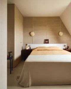 Modern Minimalist Bedroom with neutral tones and simple design elements.