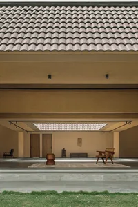 A modern house with a concrete roof and minimalist design features.