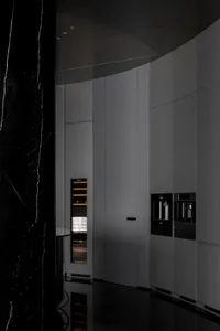 Modern kitchen with marble countertops and cabinets