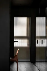 Modern minimalist interior design featuring frosted glass doors.