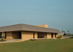 Modern residential building with concrete facade and roof