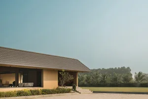 A modern residential exterior featuring concrete material and a spacious open design.