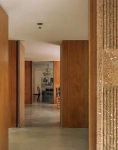 A modern residential kitchen with wooden elements and a clear, open design.