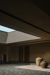 Modern interior space with tiled flooring and geometric roof structure