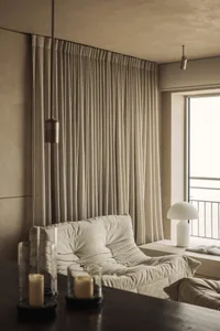 Modern living room featuring neutral-toned textiles and minimalist design.