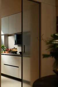 Modern kitchen with sleek, minimalist design featuring contemporary laminate materials and clean lines.