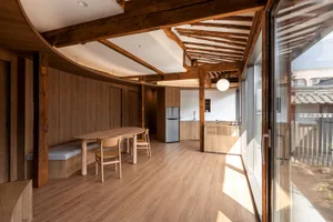 Modern kitchen featuring minimalist design with wood accents and glass paneling.