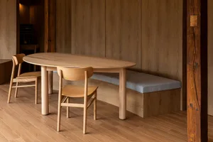 Modern dining room featuring a wooden table and chairs