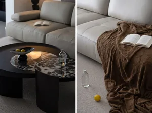 A modern living room with a leather sofa, marble coffee table, and a brown cotton throw blanket on the couch.