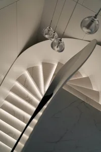 Contemporary staircase with marble steps and illuminated risers