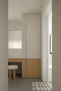 A modern minimalist cabinet in a studio apartment with a simple design and clean lines.