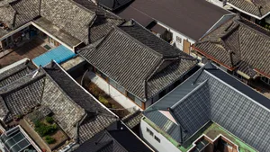 Traditional buildings with clay tile roofs arranged in a courtyard setting