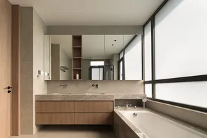Modern bathroom with granite countertop and large window