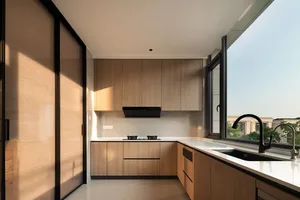 Modern kitchen featuring wooden cabinets and a glass window.