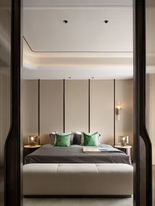 A minimalist bedroom featuring textured fabric on the bed, wooden headboard, and glass bedside lamps.