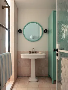 Modern bathroom featuring ceramic tiles, a concrete cabinet, and a green wall.