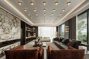 A modern living room with a marble accent wall and ceiling lights.
