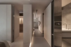 A minimalist residential space featuring concrete walls and flooring.