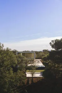 Modern house featuring glass and concrete materials, minimalist architectural style