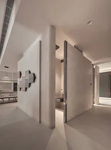 Modern living space with concrete walls and minimalist design elements.