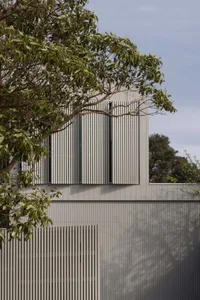 A modern exterior with metal cladding and vertical slats.