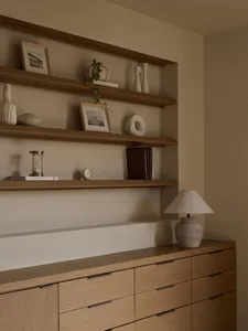 A modern minimalist office space featuring wooden furniture.