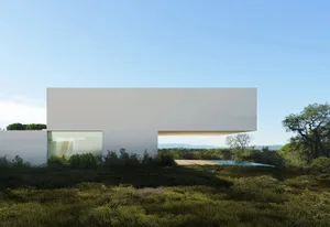 A modern minimalist white concrete residence with a cantilevered section and a glass window.