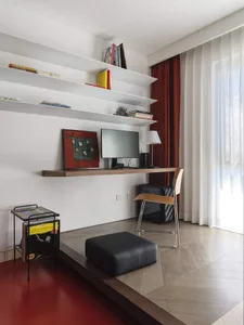 A modern living room featuring wood, leather, and metal elements.