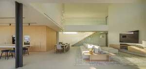 Modern interior design featuring wooden furniture, glass walls, and concrete flooring.
