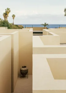 Modern architectural design featuring a sea view with concrete structures.
