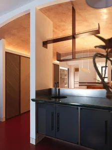 Modern kitchen with concrete cabinets and countertop.