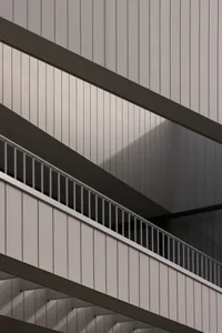 Modern metallic staircase interior design showcasing sleek, minimalist lines.