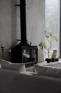 A minimalist living room with a modern fireplace.