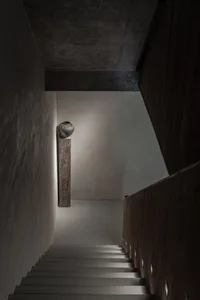 Minimalist interior design featuring a concrete staircase.