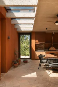 Modern residential kitchen featuring concrete and terrazzo materials.