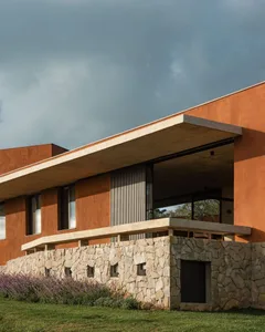 A modern building with concrete and stone exterior.