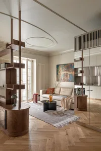 A modern living room with a wooden floor and furniture.