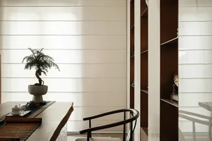 A modern home office space featuring wooden furniture and decorative elements.