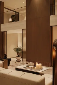 Neutral-toned leather furniture and a white marble coffee table in a modern living room