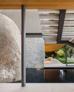 Modern architecturalterior featuring stone and glass elements