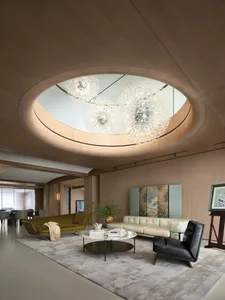 Modern living room with sleek, minimalist design, featuring wood and glass materials and a unique, eye-catching ceiling light
