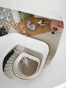 A modern living room featuring marble and concrete surfaces