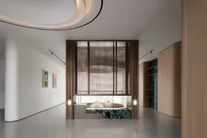 Modern, sleek lobby featuring a marble floor and wooden accents.