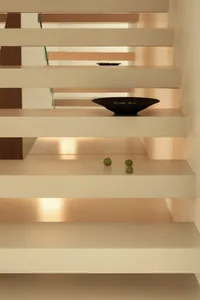 Modern interior design featuring a concrete staircase.