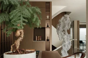 Modern living room featuring a metal organic framework sculpture.