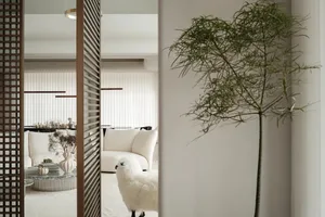 Minimalist living room with white furniture and neutral tones
