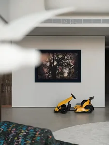 Modern minimalist living room featuring a concrete floor and stylish furniture.