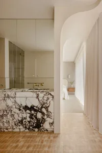 Modern bedroom featuring marble accents and minimalist design