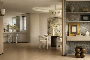 A modern living room featuring wooden furniture, marble accents, and glass elements.