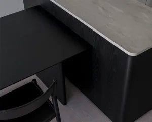 A modern workstation with a concrete countertop and black wooden elements.